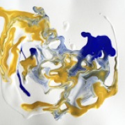 experimentation with watered paint, yellow, blue and white on paper and tilted to intermingle the colours